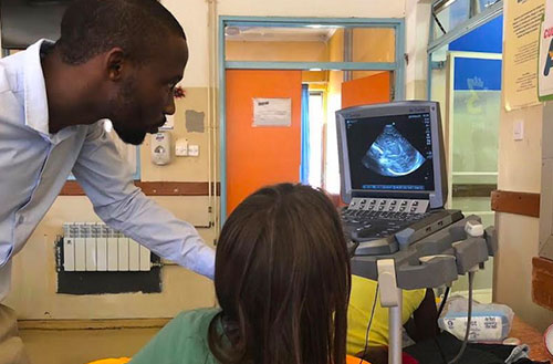 Practicing and teaching bedside cranial ultrasound.